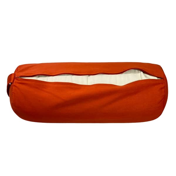 A terracotta orange bolster unzipped showing the inner casing containing buckwheat
