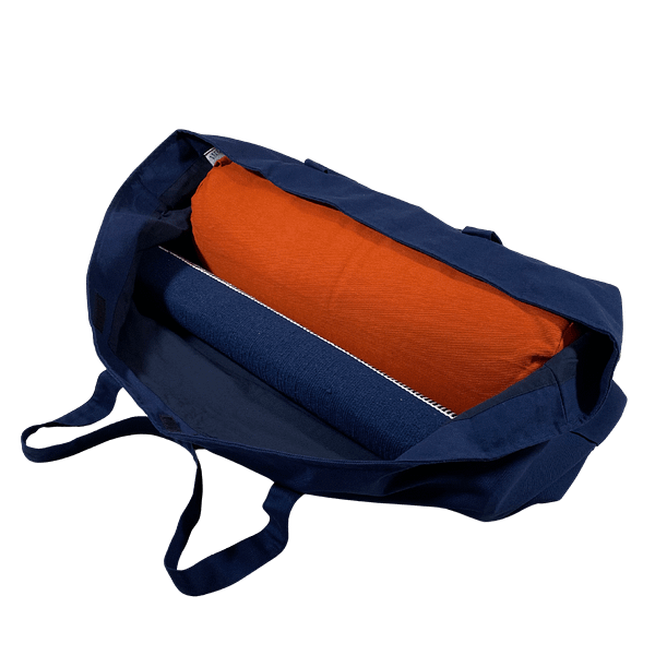 The kit bag holds a standard bolster and a yoga mat